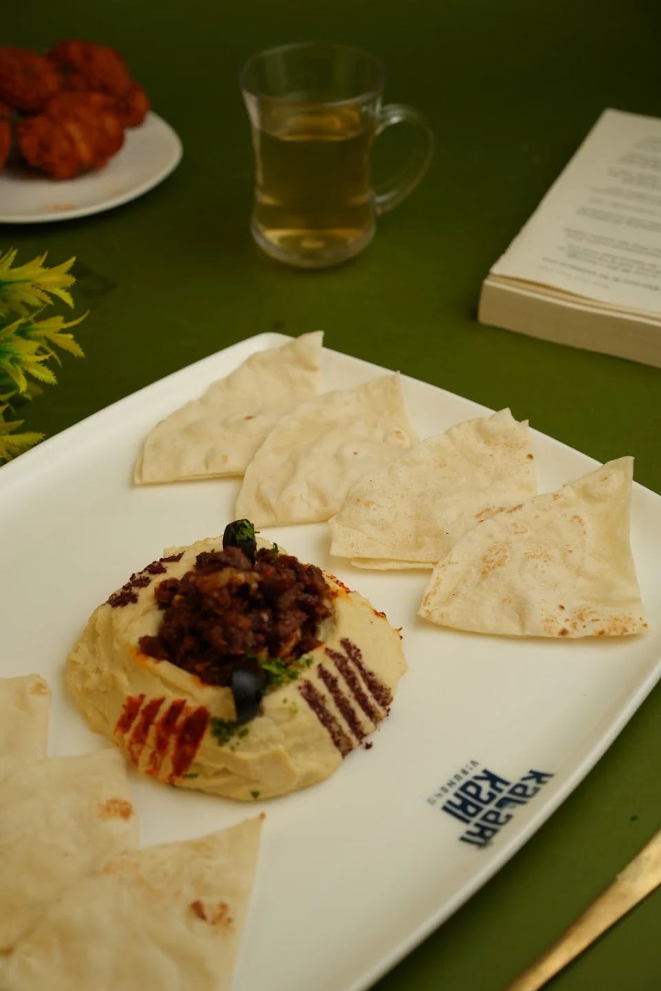 Hummus with warm kubboos and meat